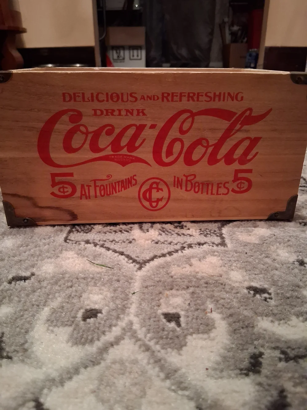 Coca-Cola Crate with Bold Red Logo on Wood
